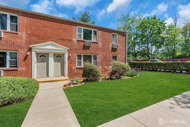 66 Fox Rd Unit 10A, Edison, NJ 08817 - colonial-style house featuring a front yard and brick siding