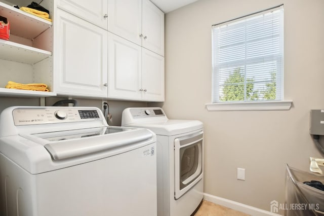415 Lorillard Ave, Union Beach, NJ 07735 - clothes washing area featuring baseboards, cabinet space, and washing machine and clothes dryer