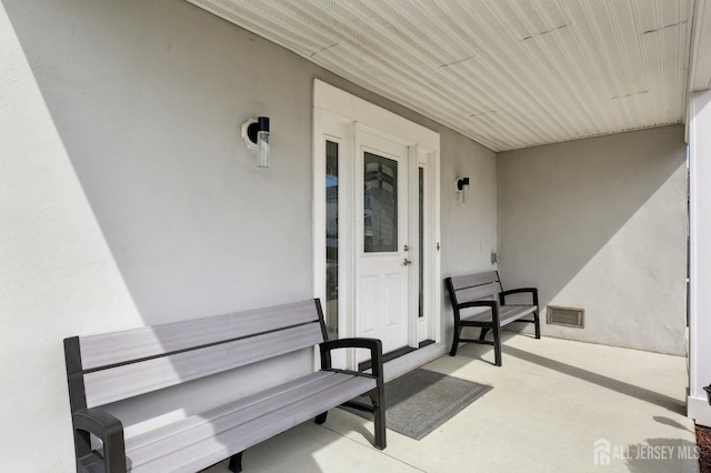 415 Lorillard Ave, Union Beach, NJ 07735 - entrance to property featuring visible vents and stucco siding
