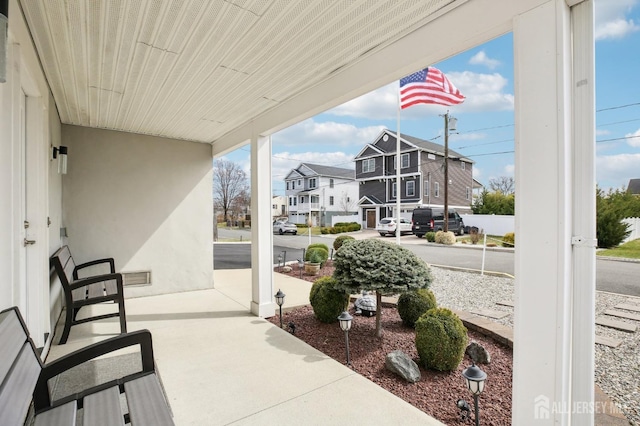 415 Lorillard Ave, Union Beach, NJ 07735 - view of patio with covered porch and a residential view