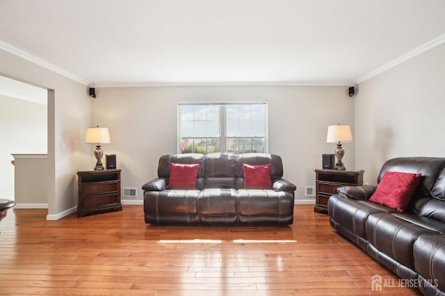415 Lorillard Ave, Union Beach, NJ 07735 - living room with crown molding, baseboards, hardwood / wood-style flooring, and visible vents