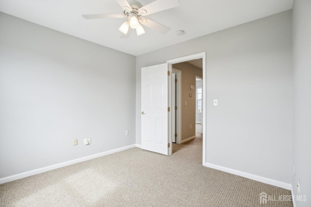 415 Lorillard Ave, Union Beach, NJ 07735 - unfurnished bedroom with baseboards, light colored carpet, and ceiling fan