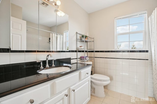 415 Lorillard Ave, Union Beach, NJ 07735 - full bathroom with plenty of natural light, tile patterned flooring, visible vents, and tile walls