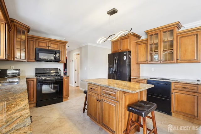 415 Lorillard Ave, Union Beach, NJ 07735 - kitchen featuring brown cabinets, decorative light fixtures, a kitchen breakfast bar, black appliances, and crown molding