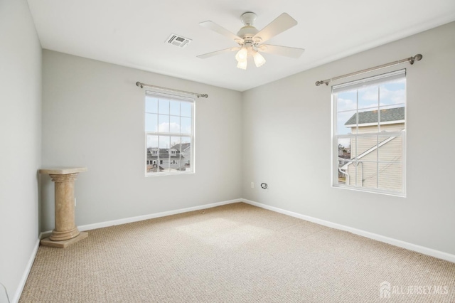 415 Lorillard Ave, Union Beach, NJ 07735 - carpeted spare room featuring baseboards, plenty of natural light, a ceiling fan, and visible vents