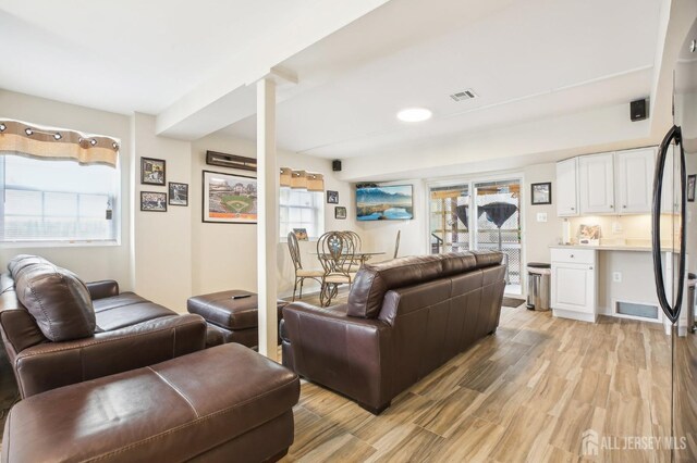 415 Lorillard Ave, Union Beach, NJ 07735 - living area featuring light wood-style floors and visible vents