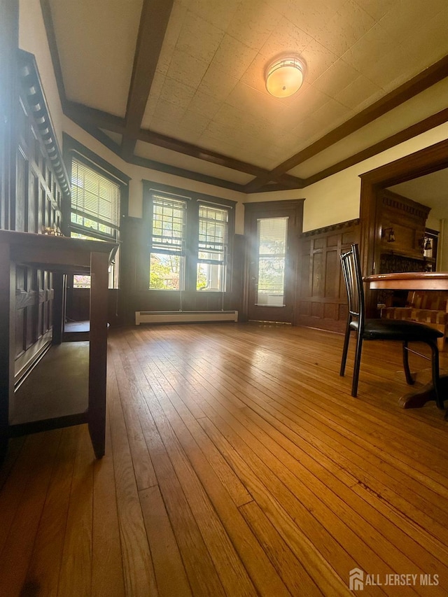 451 E Main St, Somerville, NJ 08876 - unfurnished dining area featuring baseboard heating and hardwood / wood-style flooring