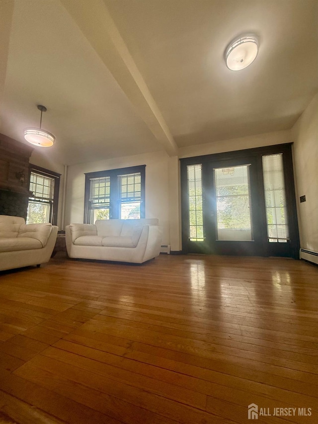 451 E Main St, Somerville, NJ 08876 - unfurnished living room featuring hardwood / wood-style floors and baseboard heating