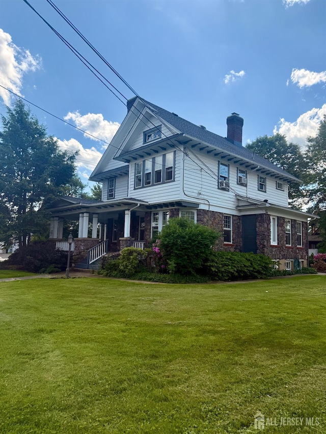 451 E Main St, Somerville, NJ 08876 - view of front of property featuring a chimney, a front yard, and covered porch