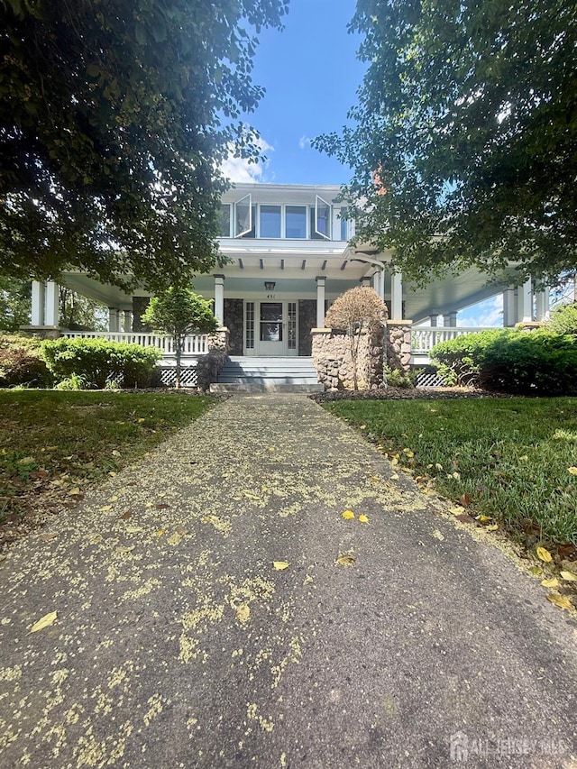 451 E Main St, Somerville, NJ 08876 - view of front of property with a porch, stone siding, and driveway