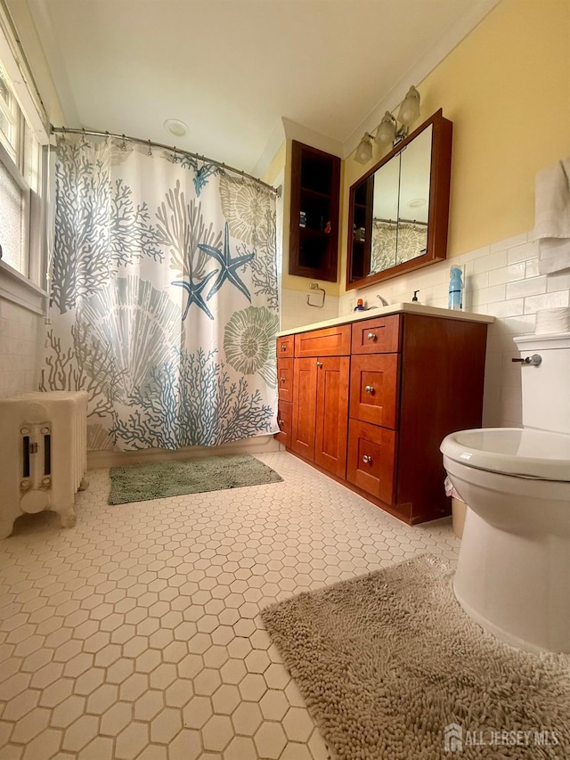 451 E Main St, Somerville, NJ 08876 - bathroom featuring toilet, vanity, tile walls, and a shower with curtain