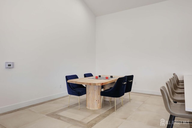 dining area featuring baseboards