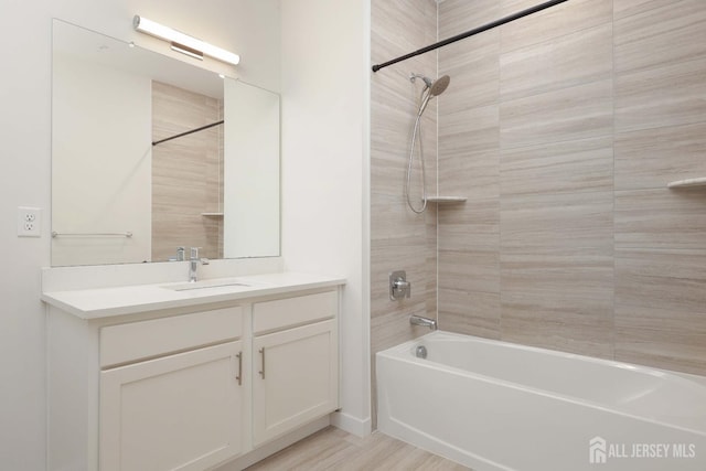 bathroom with vanity and bathing tub / shower combination