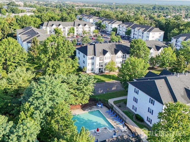 birds eye view of property with a residential view