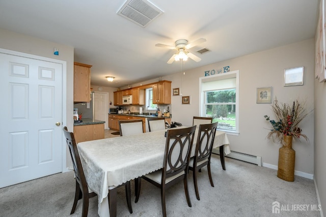 17 Duane St, Jamesburg, NJ 08831 - dining space featuring light colored carpet, ceiling fan, and baseboard heating