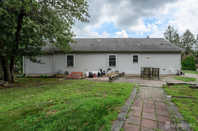 17 Duane St, Jamesburg, NJ 08831 - rear view of property with a patio area, a lawn, and a shingled roof