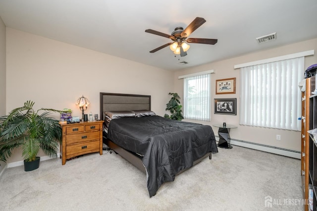 17 Duane St, Jamesburg, NJ 08831 - bedroom featuring baseboard heating, light colored carpet, and a ceiling fan