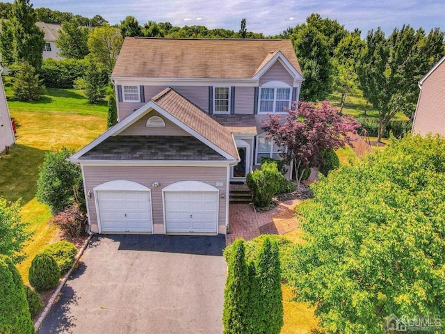 18 Bucknell Dr, East Brunswick, NJ 08816 - view of front of property with a garage, a front lawn, aphalt driveway, and a shingled roof