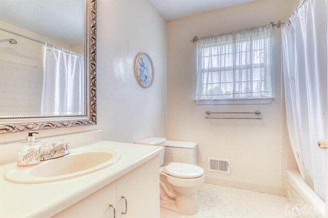 18 Bucknell Dr, East Brunswick, NJ 08816 - full bath featuring toilet, tile patterned floors, visible vents, and vanity