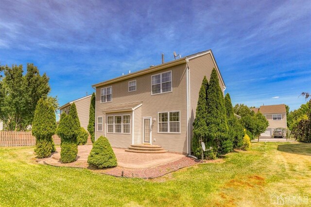18 Bucknell Dr, East Brunswick, NJ 08816 - back of house featuring a lawn and fence
