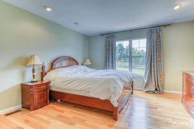 18 Bucknell Dr, East Brunswick, NJ 08816 - bedroom with baseboards, light wood-type flooring, and visible vents