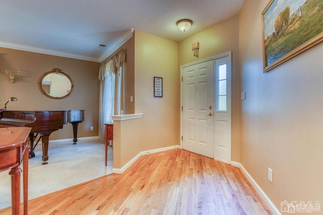 18 Bucknell Dr, East Brunswick, NJ 08816 - foyer featuring baseboards, ornamental molding, and light wood-style flooring