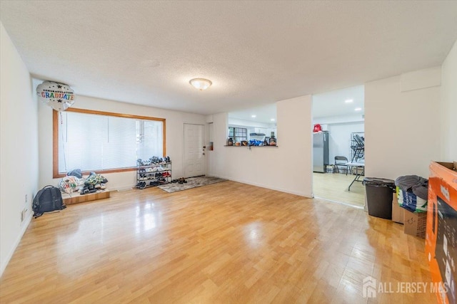 36 Henry St, Edison, NJ 08820 - exercise room featuring light wood-style flooring and a textured ceiling