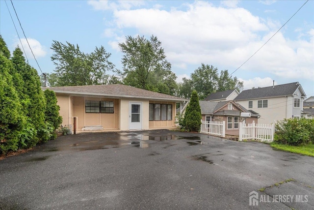 36 Henry St, Edison, NJ 08820 - view of front of home featuring stucco siding and asphalt driveway