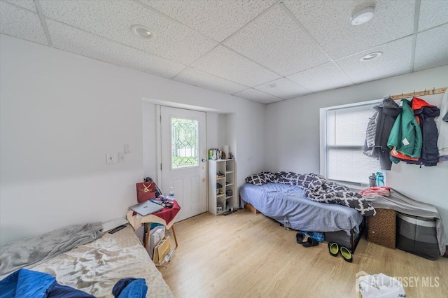 36 Henry St, Edison, NJ 08820 - bedroom featuring a drop ceiling, wood finished floors, and multiple windows