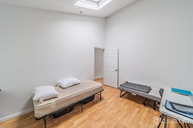 36 Henry St, Edison, NJ 08820 - sitting room featuring a skylight, light wood-style flooring, and lofted ceiling