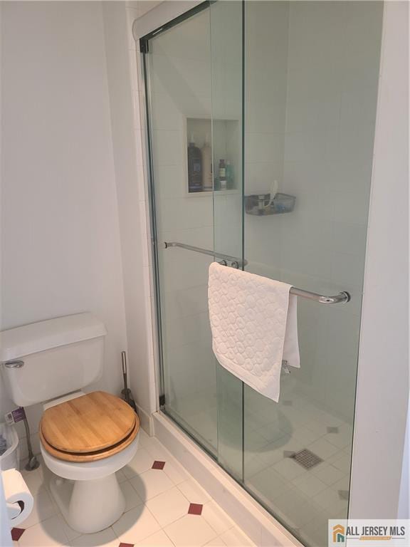 297 Prestwick Way Unit 297, Edison, NJ 08820 - full bath featuring toilet, a shower stall, and tile patterned floors