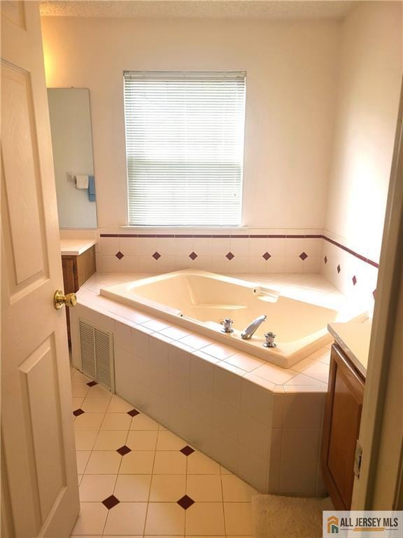 297 Prestwick Way Unit 297, Edison, NJ 08820 - full bath with vanity, a garden tub, and tile patterned flooring