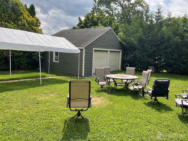 surrounding community featuring an outbuilding and a yard