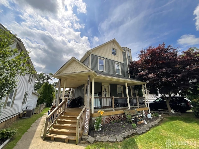 view of front of house featuring central AC unit and a porch