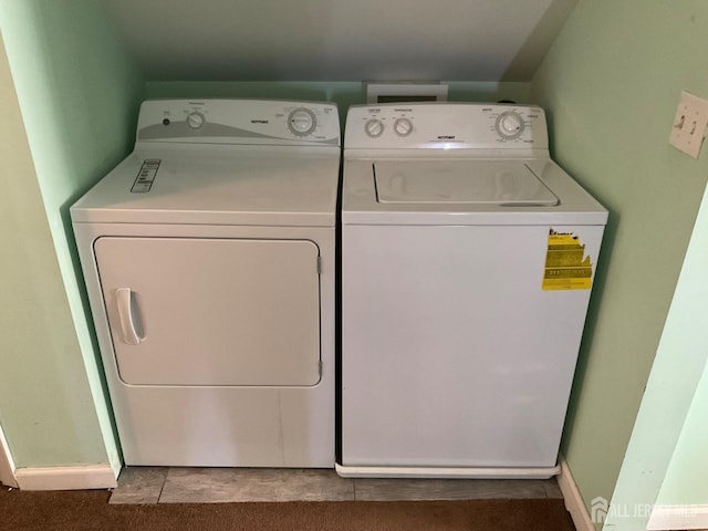 laundry area with separate washer and dryer