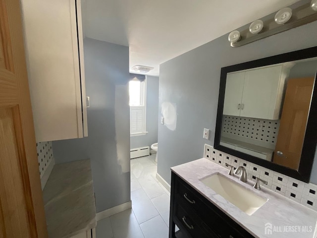 bathroom with baseboard heating, tile patterned flooring, tasteful backsplash, vanity, and toilet