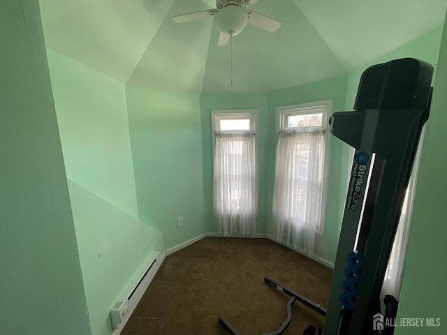 exercise room with a baseboard radiator, lofted ceiling, ceiling fan, and dark carpet