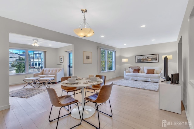 dining room featuring light wood-style floors, recessed lighting, ceiling fan, and baseboards