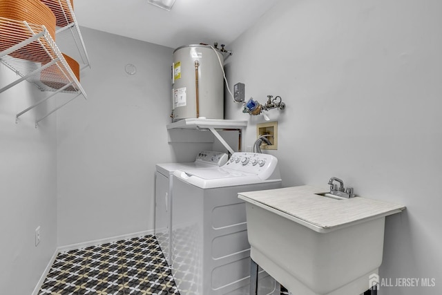 clothes washing area with laundry area, tile patterned floors, a sink, independent washer and dryer, and gas water heater