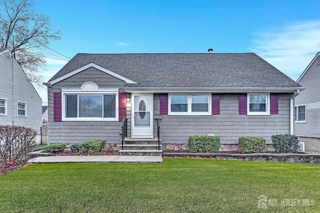 view of front of home with a front lawn