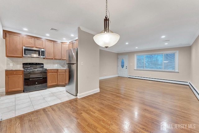 kitchen featuring appliances with stainless steel finishes, decorative light fixtures, backsplash, ornamental molding, and light wood-type flooring