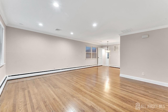 empty room with ornamental molding, baseboard heating, and light hardwood / wood-style flooring