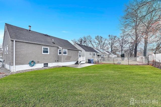 rear view of property featuring a patio and a lawn