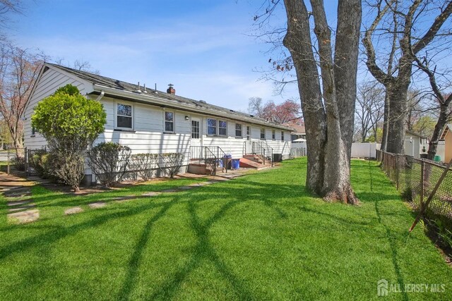 1779 Hughes Ter, Piscataway, NJ 08854 - rear view of property featuring a chimney