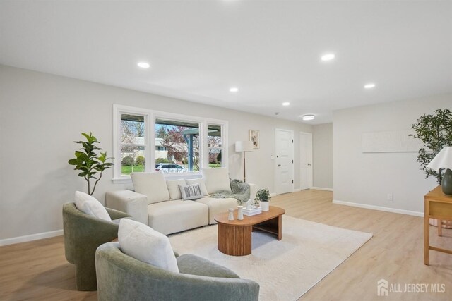 1779 Hughes Ter, Piscataway, NJ 08854 - living area featuring light wood-style floors, recessed lighting, and baseboards