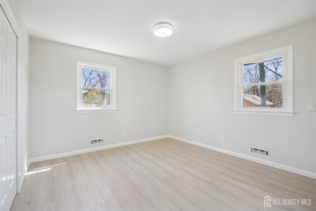 1779 Hughes Ter, Piscataway, NJ 08854 - unfurnished bedroom with wood finished floors, baseboards, and a closet