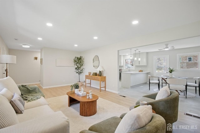 1779 Hughes Ter, Piscataway, NJ 08854 - living room featuring light wood-type flooring, recessed lighting, and baseboards