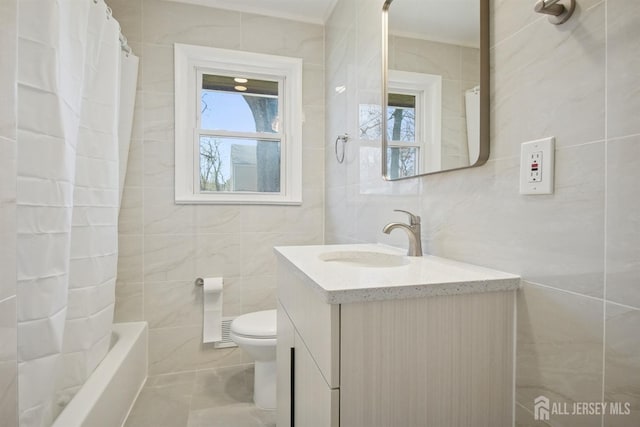 1779 Hughes Ter, Piscataway, NJ 08854 - full bathroom with tile walls, toilet, vanity, and shower / tub combo