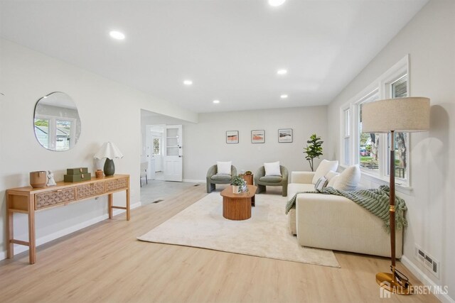 1779 Hughes Ter, Piscataway, NJ 08854 - living room featuring light wood finished floors, plenty of natural light, recessed lighting, and baseboards