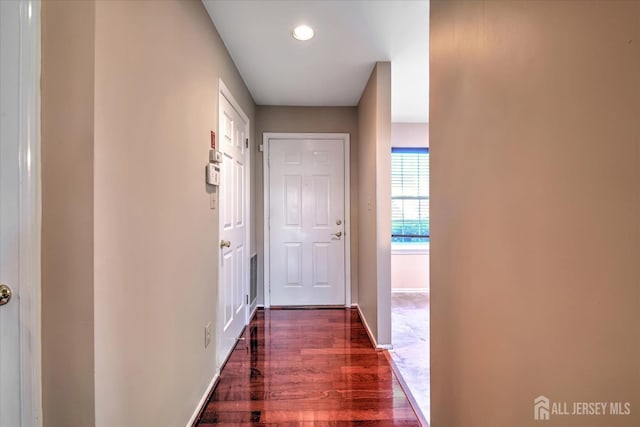 hallway with dark wood-type flooring